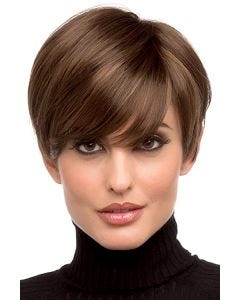 Woman in a long medium brown pixie wig with side swept bangs and shorter hair in back
