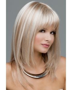 Woman in a long, past the shoulders platinum blonde wig with shoulder length layered and feathered bangs