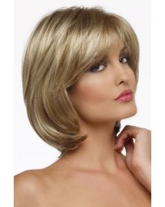 Woman in shoulder length highlighted blonde cropped bob wig with layers and curtain bangs