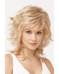 Woman in a shoulder length light blonde wig with feathered layers and choppy bangs