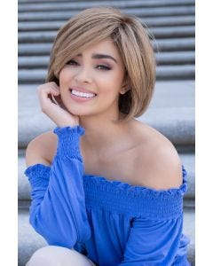 Woman in chin length black blunt bob wig with layering along the face