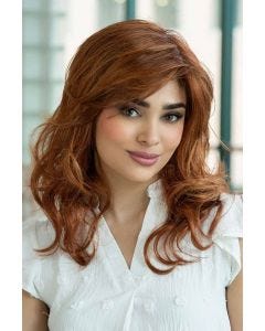 Woman in a past the shoulders curly dark blonde lace front wig with layers along the face