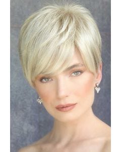Woman in a platinum blonde pixie wig with longer hair on top and side bangs