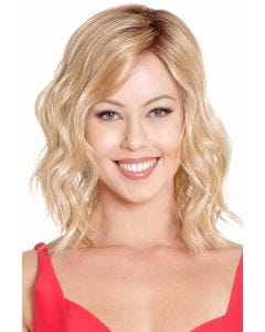 Woman in a shoulder length dark brown curly lace front wig