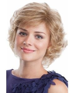 Woman in a past the chin light blonde curly wig with side bangs