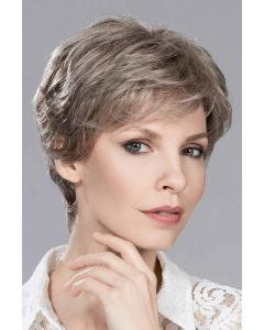 Woman in a long grey and brown lace front pixie wig