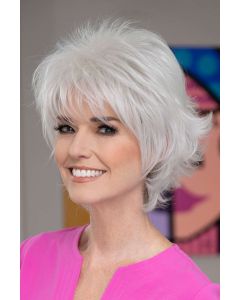 Woman in a short textured light brown wig
