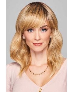 Long layered wavy wig with side-swept bangs and soft blonde highlights for natural everyday wear.