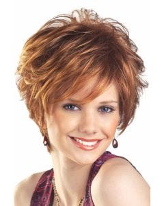 Woman in a tousled light red layered pixie wig with side bangs