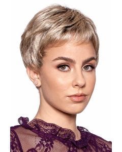 Woman in a short light blonde pixie wig with short bangs
