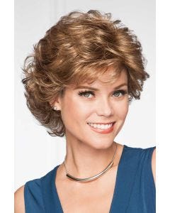 Woman in a voluminous, dark blonde, layered, long pixie wig with light fringe bangs