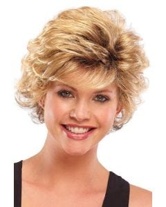 Woman in a long strawberry blonde pixie wig with longer layers on top and side bangs