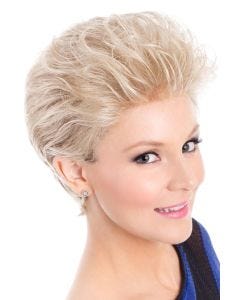 Woman in a brushed back platinum long pixie wig