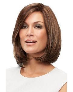 Woman in a large shoulder length blunt cut medium brown wig