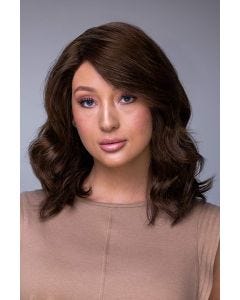 Woman in a petite shoulder length dark brown curly human hair wig
