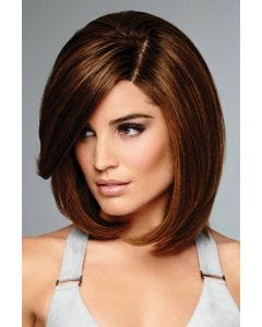 Raquel Welch in a shoulder length reddish blonde bob wig with long side bangs