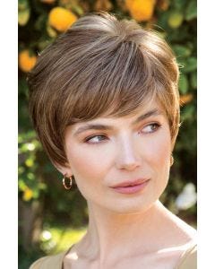 Woman in a long light brown lace front pixie with with side bangs