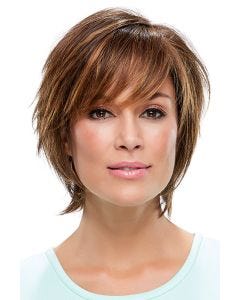 Woman in a chin length medium auburn bob wig with side bangs and feathered layers