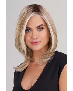 Woman in a straight, light brown and blonde wig with textured layering at the end and along the face