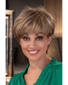 Woman in a long dark auburn feathered pixie wig with fringe bangs and longer hair at the nape