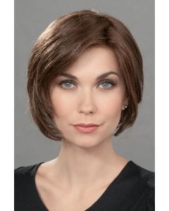 Woman in a chin length dark brown lace front rounded bob wig