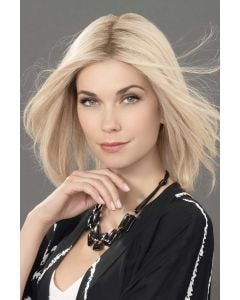 Woman in a 12" light blonde hair topper blended with her hair