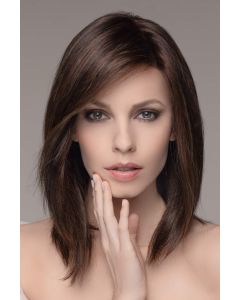 Woman in a past the shoulders dark brown lace front wig with light layering
