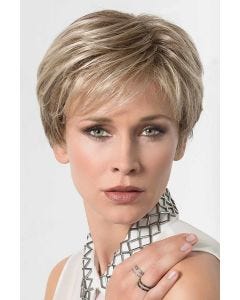 Woman in a long evenly layered blonde lace front pixie wig