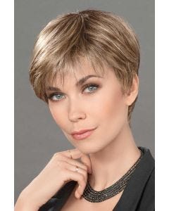 Woman in a classic light brown pixie wig with textured bangs