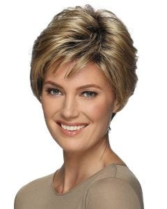Woman in a short light brown layered wig