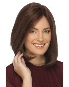 Woman in a shoulder length semi-angled medium auburn human hair wig