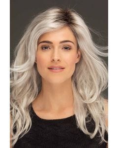 Woman in an extra long tousled platinum blonde lace front layered wig