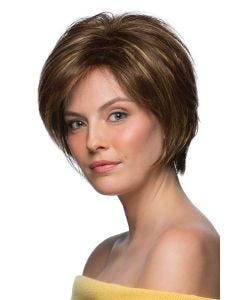Woman in a chin length chestnut brown layered bob wig with side bangs