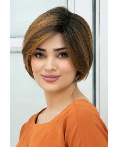 Woman in a chin length medium auburn rounded bob wig