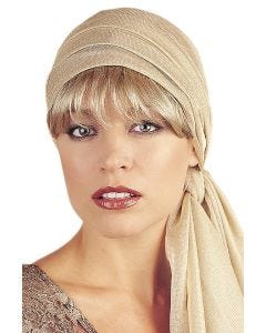 Woman in blonde detachable bangs worn under a beige head scarf