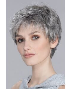 Short textured pixie wig with soft volume, wispy bangs, and tapered nape