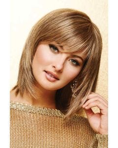 Woman in a dark blonde shoulder length bob wig with razored ends and side swept bangs