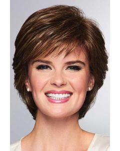 Woman in a layered medium brown short wig with fringe side bangs