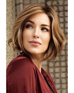 Woman in a past the chin warm brown wavy lace front bob wig
