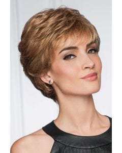 Woman in a dark blonde classic layered pixie wig with short choppy bangs