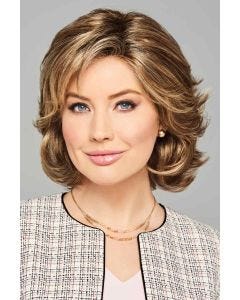 Woman in a chin length layered light brown lace front bob wig with side bangs