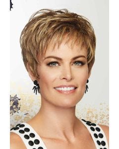 Woman in a light brown short layered pixie wig with fringe bangs