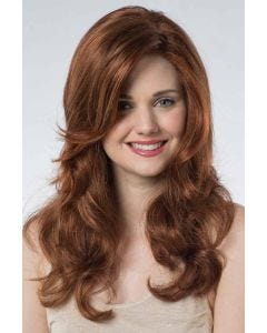 Woman in an extra long medium auburn curly lace front wig