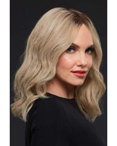 Woman in a past-the-shoulders, light ash blonde, wavy lace front wig