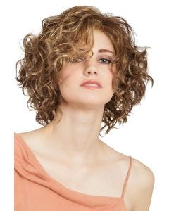 Woman in a shoulder length dark blonde curly lace front wig