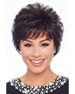Woman in a long full dark brown pixie wig with fringe bangs