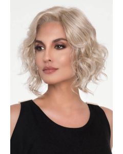 Woman in a shoulder length angled platinum blonde bob lace front wig