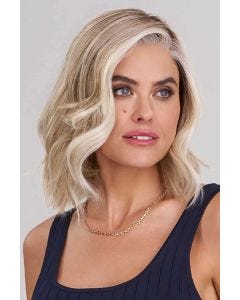 Woman in an auburn shoulder length blunt bob wig with curled under ends