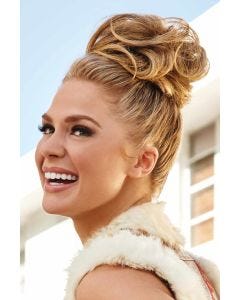 Woman in a strawberry blonde curly hair wrap attached to her hair