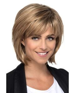 Woman in a shoulder length light auburn layered bob wig with fringe bangs